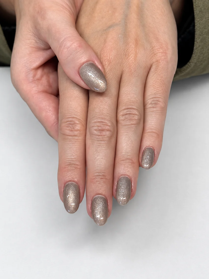 Year-round neutral taupe manicure with delicate silver shimmer